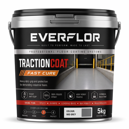 A 5kg bucket of Everflor TractionCoat Fast Cure system pack floor coating, shown on a clean white background. The bucket is black and silver with a label depicting a concrete warehouse ramp and detailing the product's features.